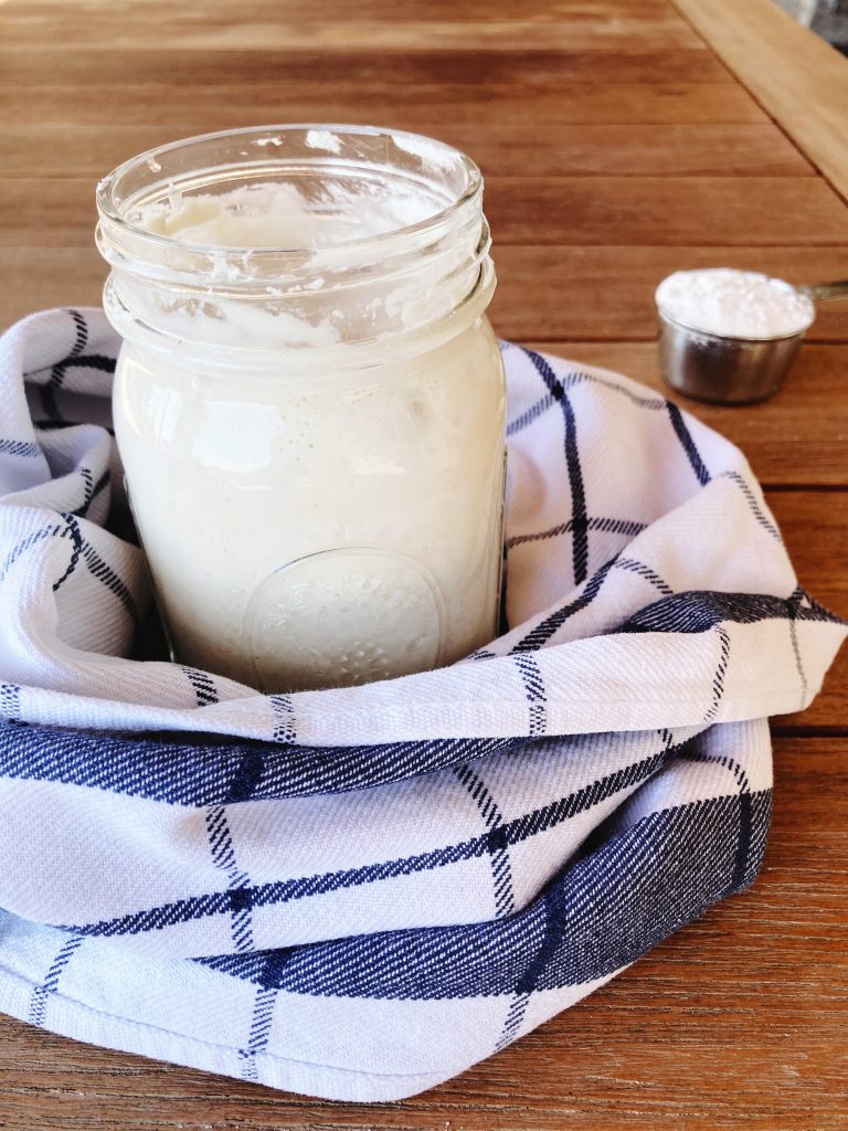 jar with sourdough in towel
