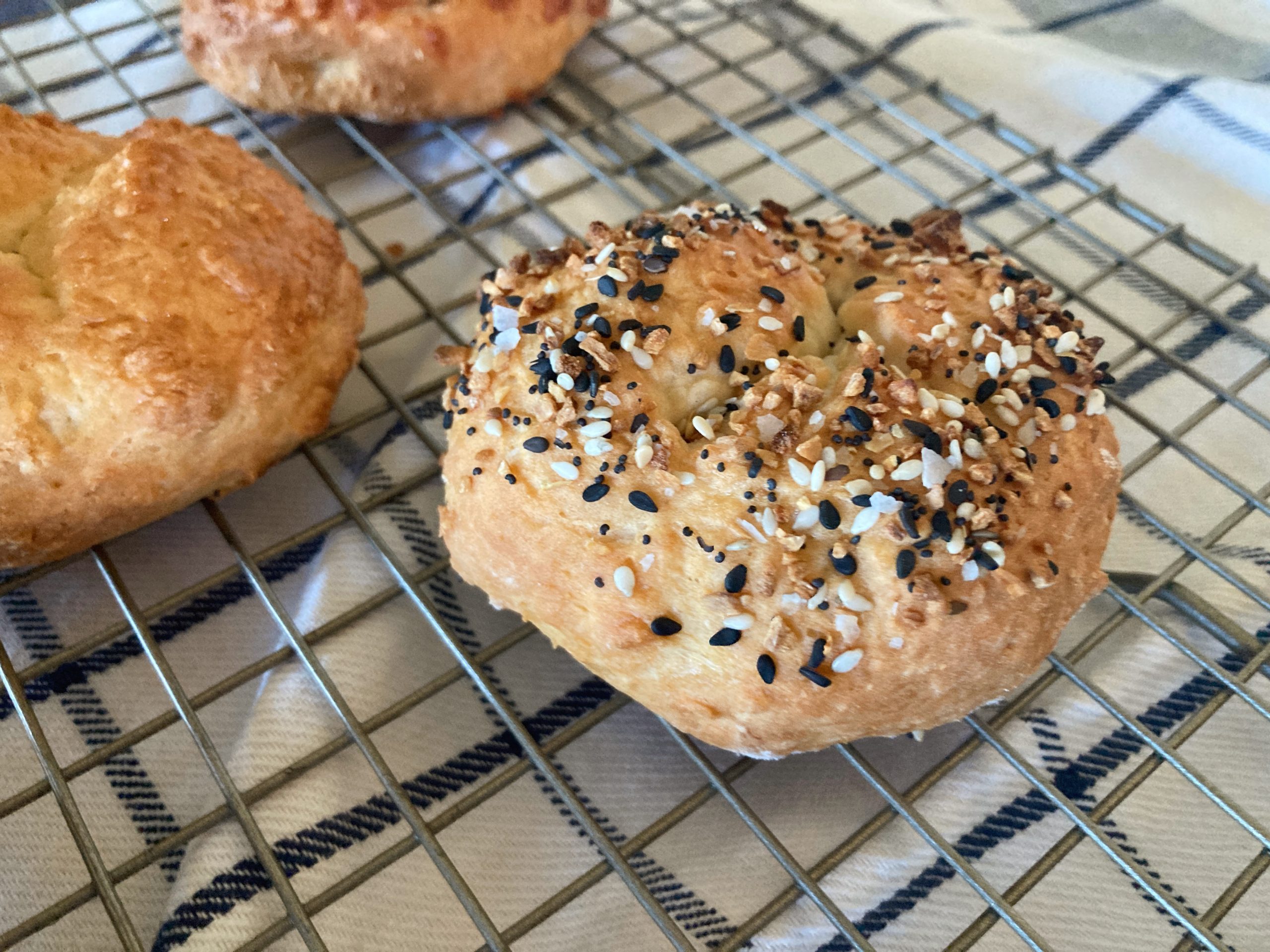 sourdough discard everything bagel on baking rack