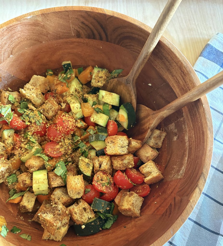 bowl with sourdough panzanella and towel
