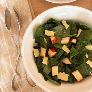 apple and white cheddar salad in white bowl