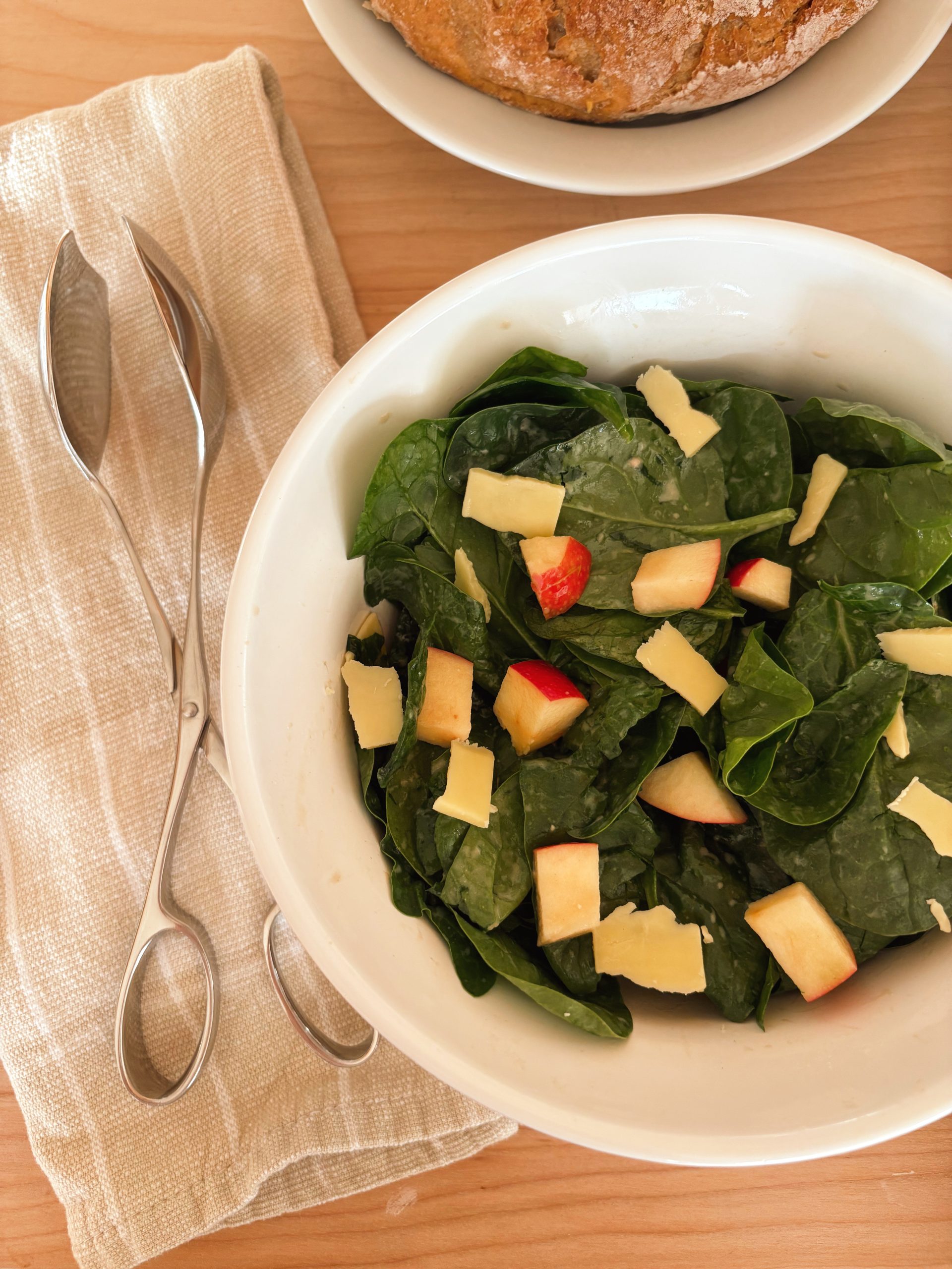 apple and white cheddar salad in white bowl