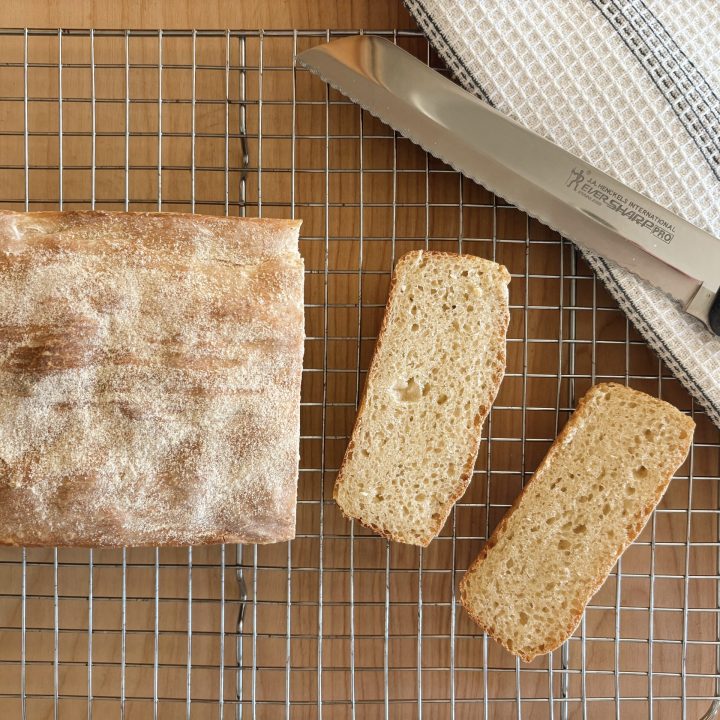 slices of sourdough english muffin bread with knife