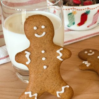 sourdough gingerbread man next to glass of milk with candy