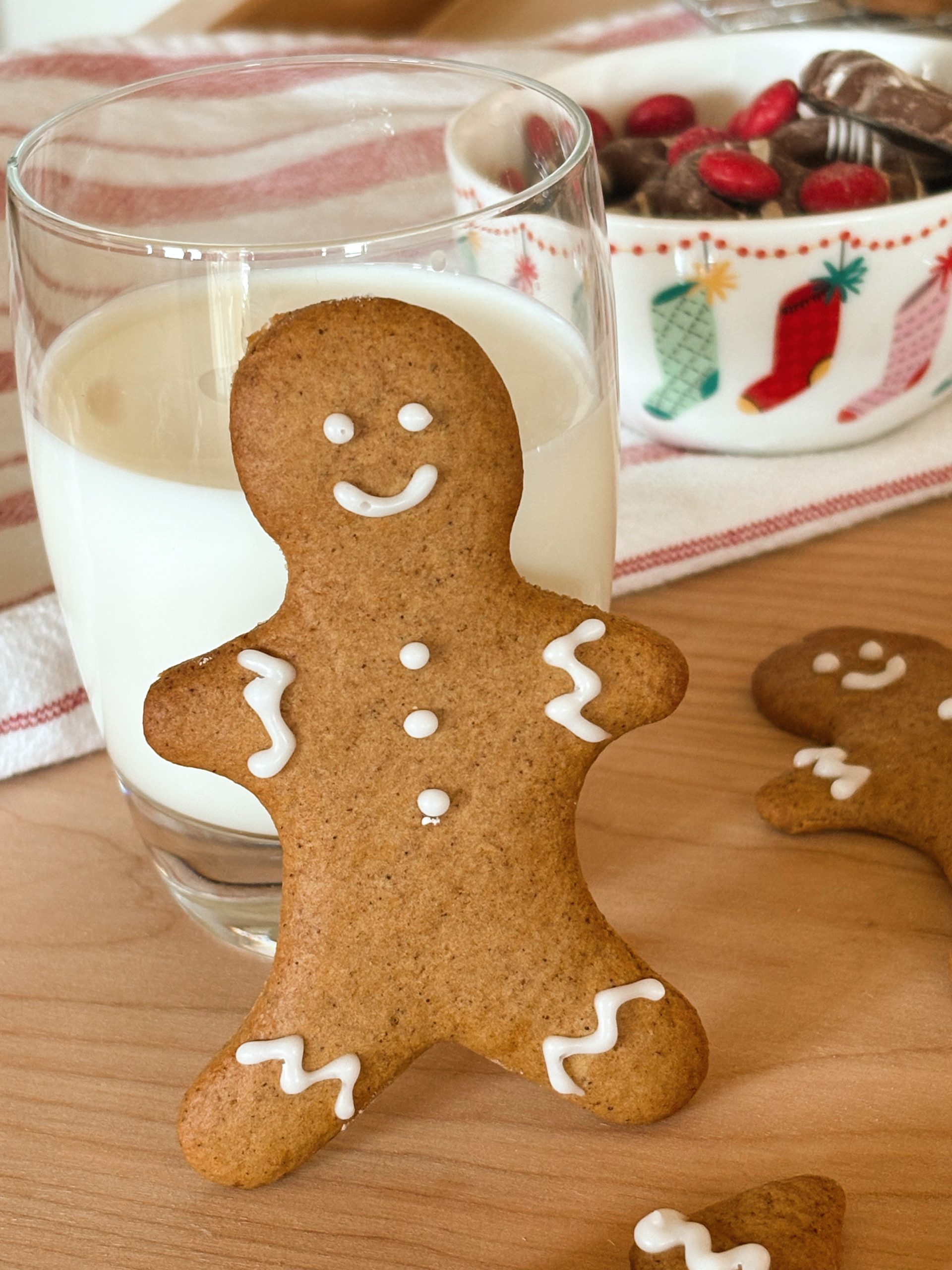 sourdough gingerbread man next to glass of milk with candy