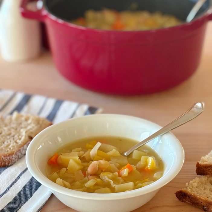 bowl with cabbage and white bean soup