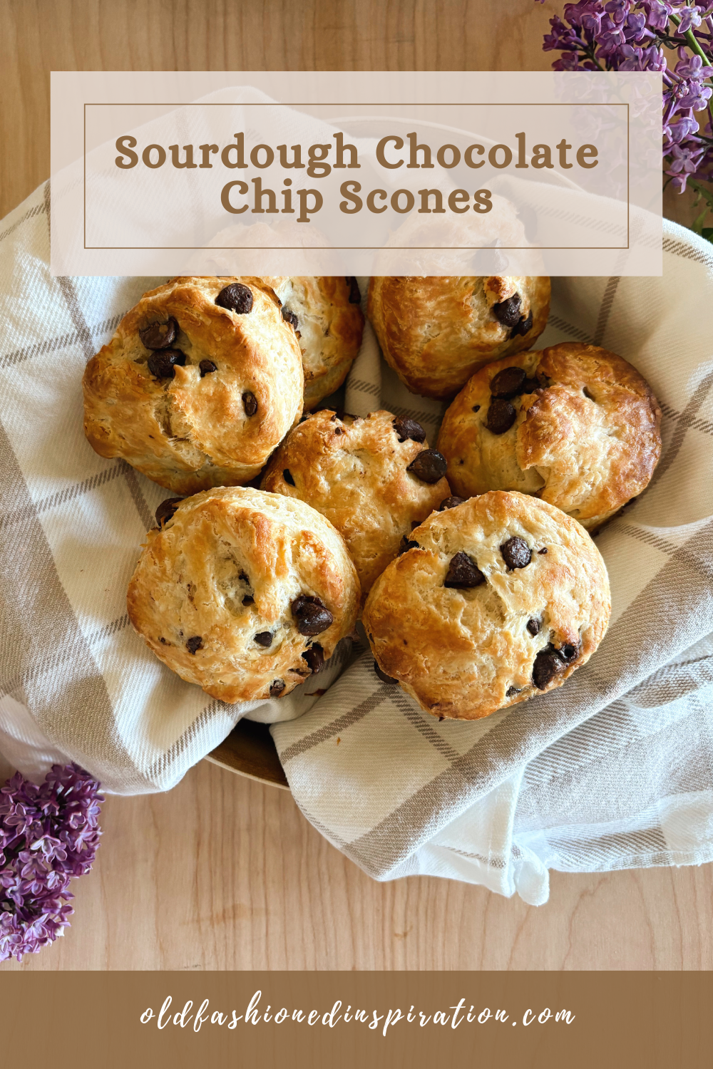 sourdough chocolate chip scones in a basket with towel and lilacs